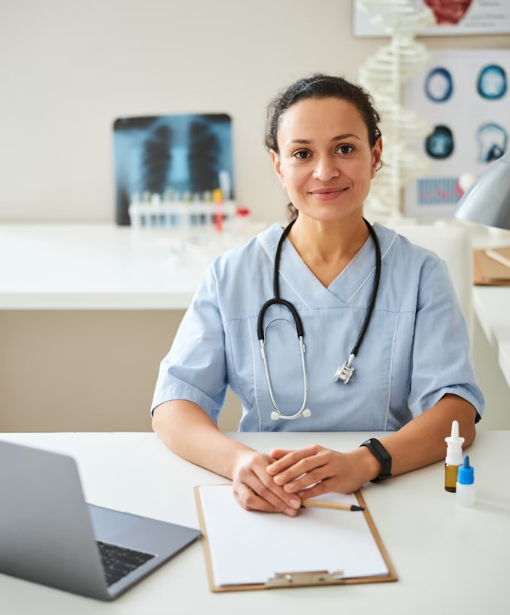 Medical professional at desk with documentation